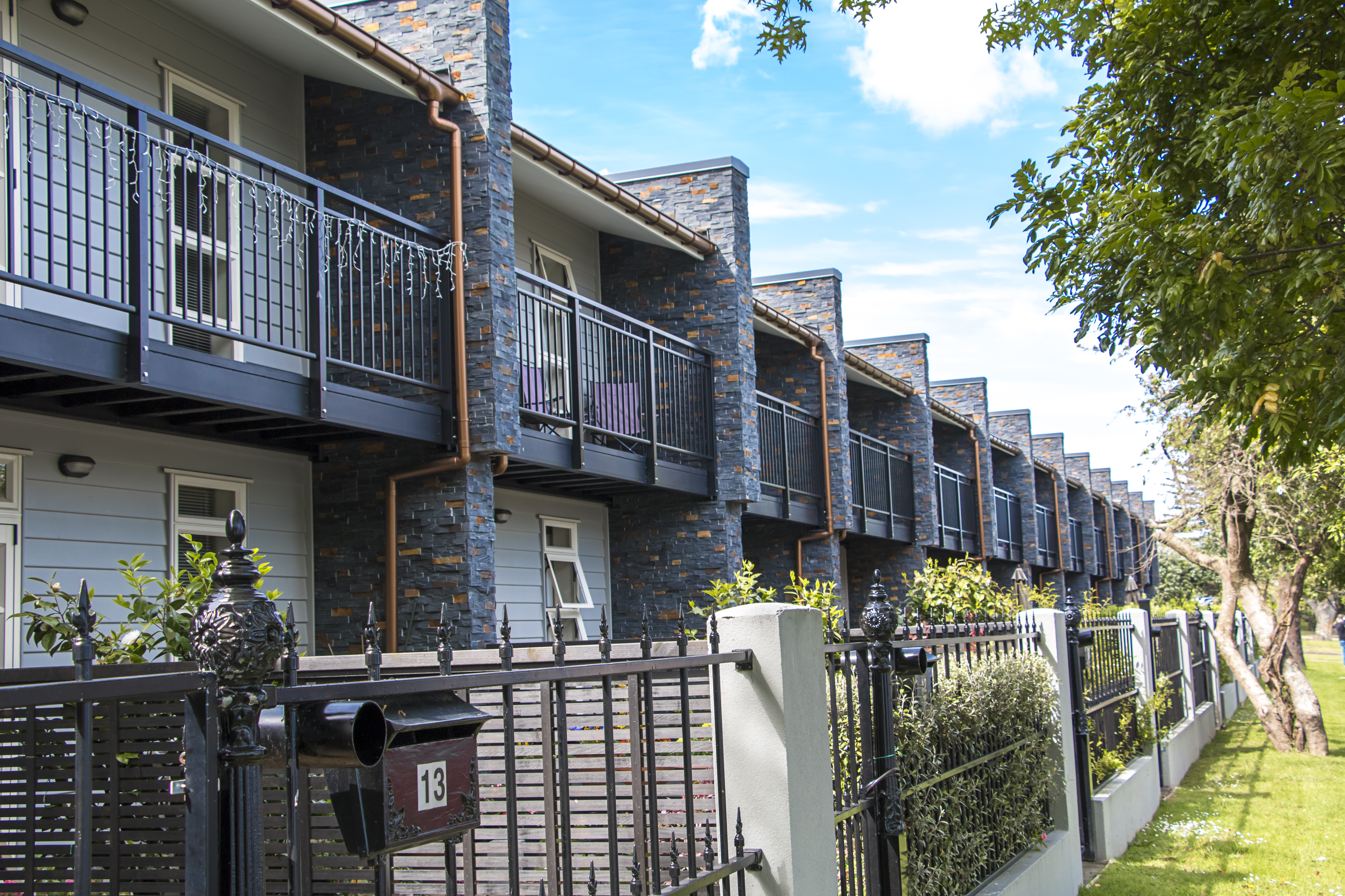 Ellerslie apartments with Marley copper spouting using Marley Typhoon and RP80 downpipe